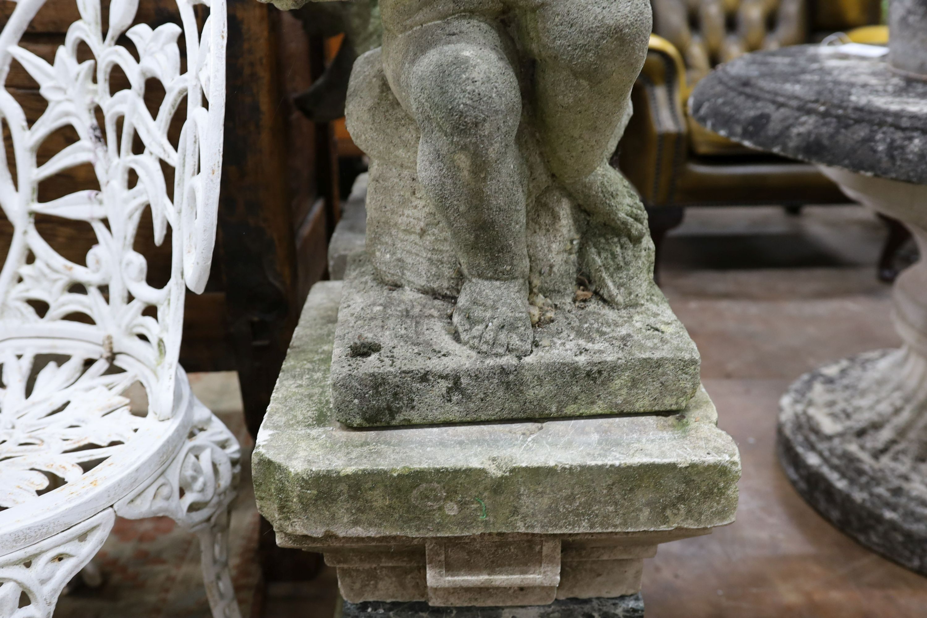 A pair of reconstituted stone cherub and dove garden ornaments on faux marble plinths, height 116cm